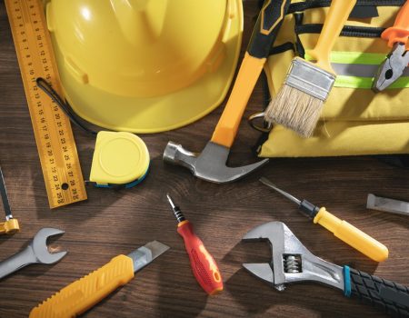 Work tools on the wooden background.